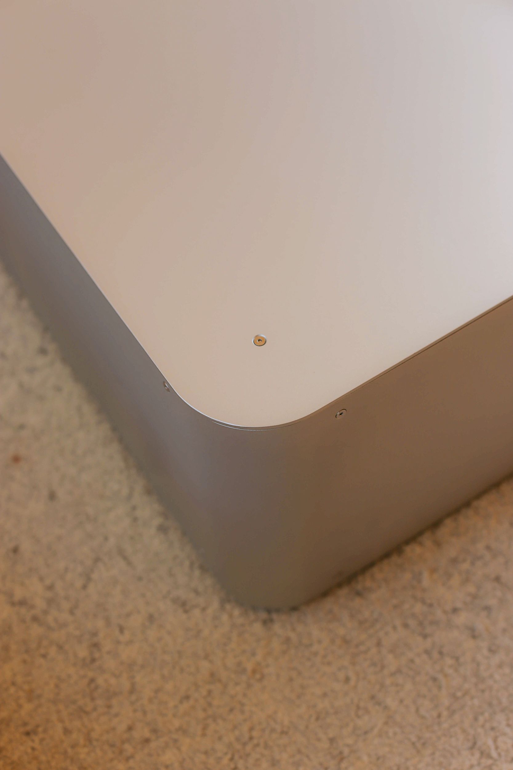 Close up on the joining of the coffee table by PARCTA sat on a neutral rug.