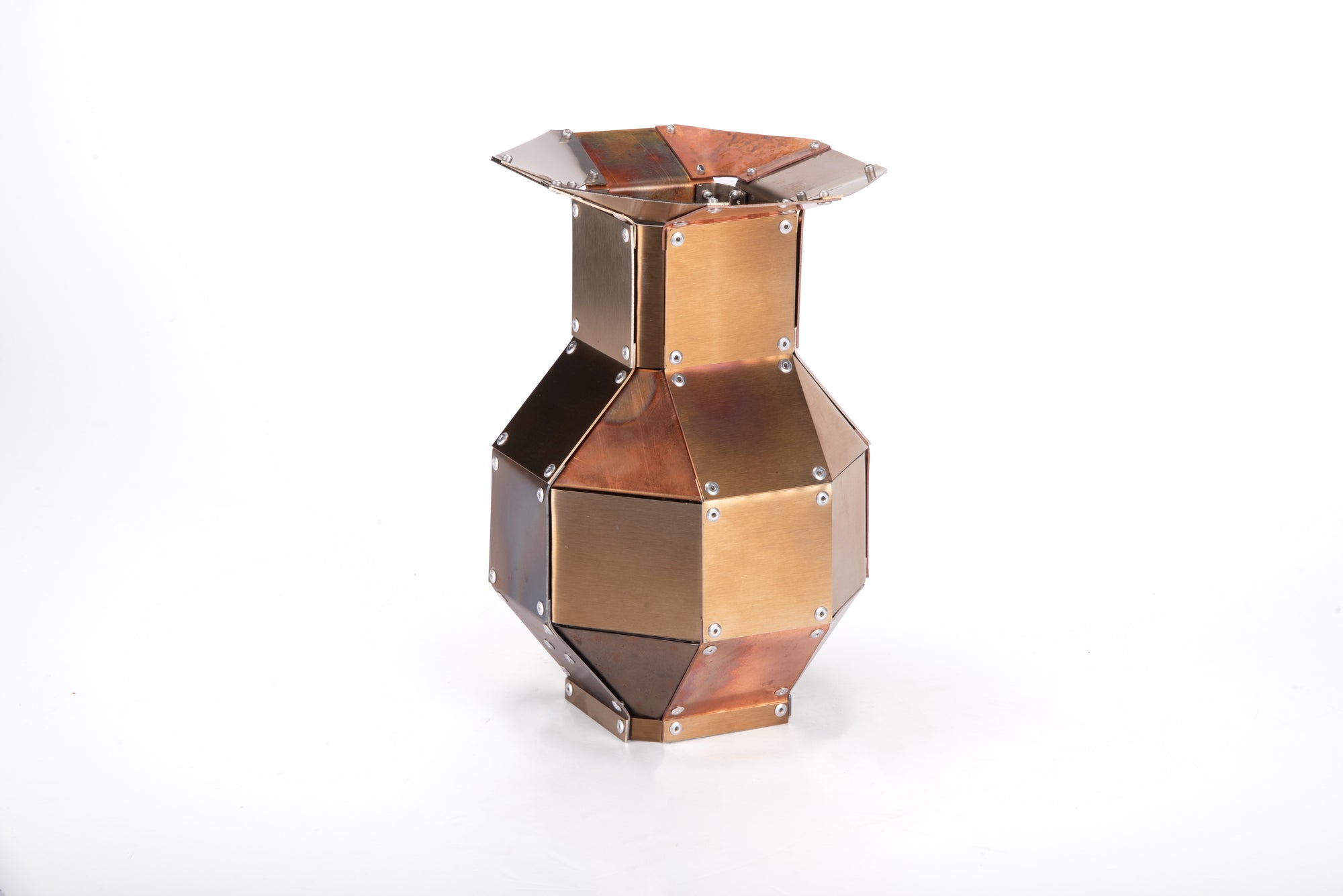 Stainless steel and copper decorative object by Theo Galliakis on a white background.