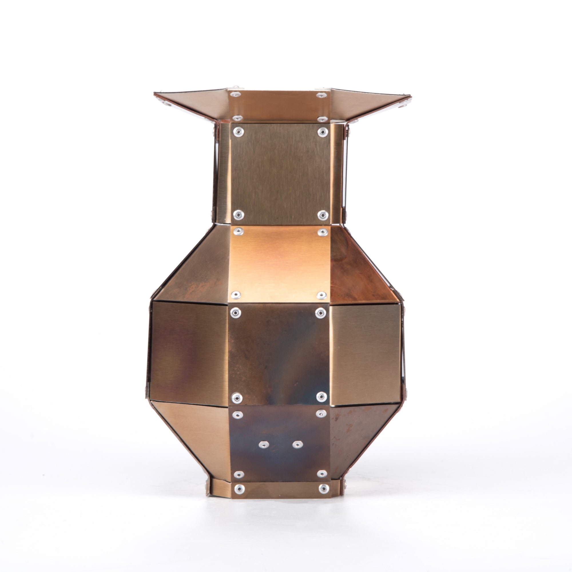 Stainless steel and copper decorative object by Theo Galliakis on a white background.