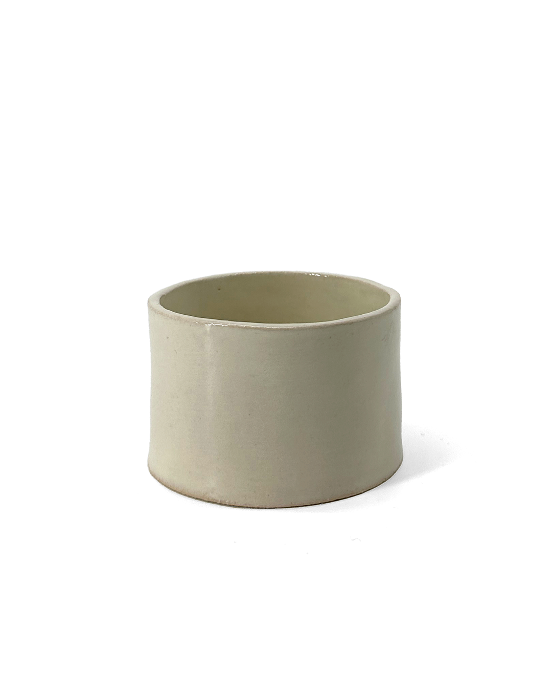 Ivory, glossy ceramic coffee cup by klangnapha on a white background.