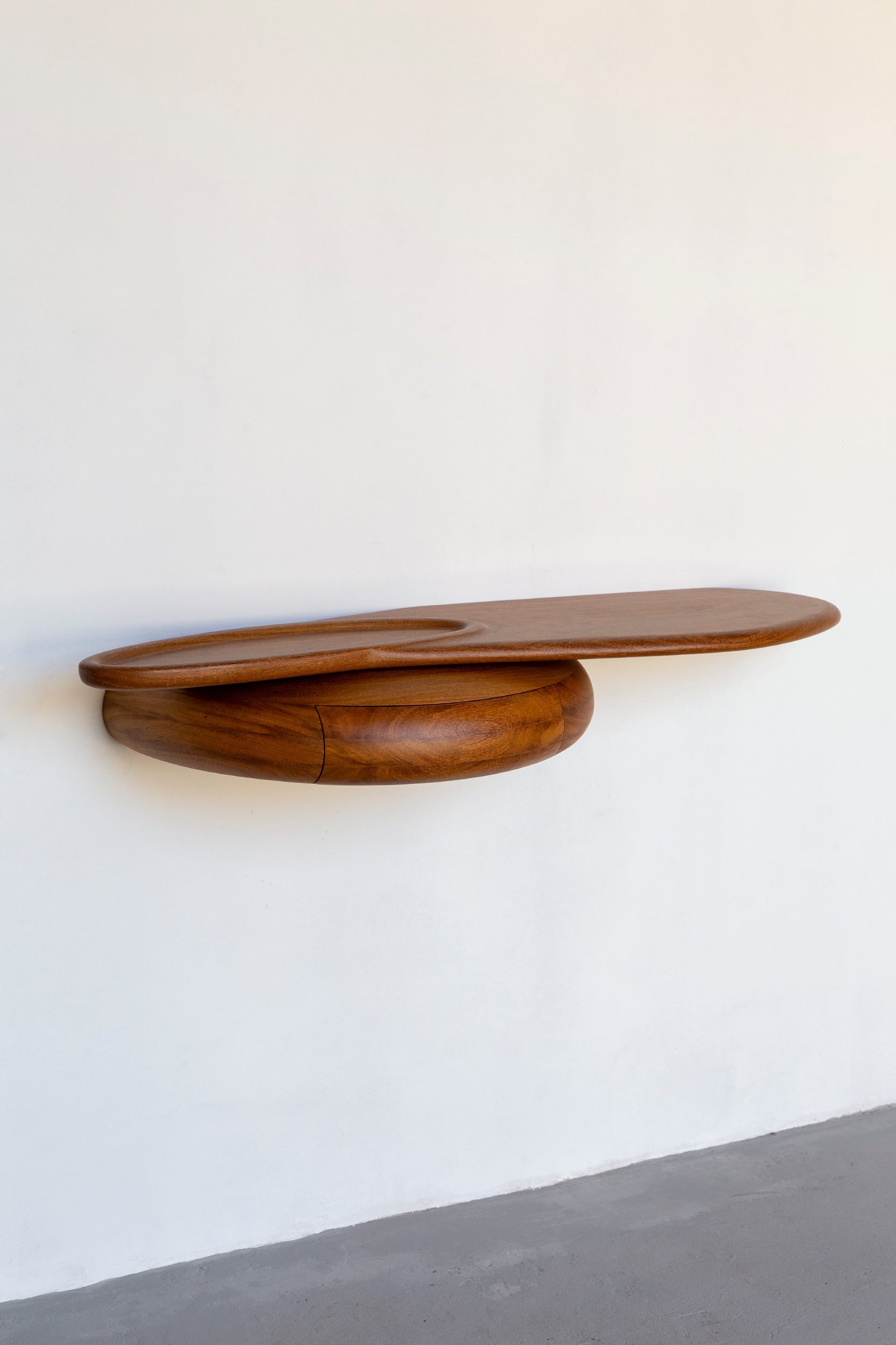 Shelf by Estudio Prosa on a white wall.