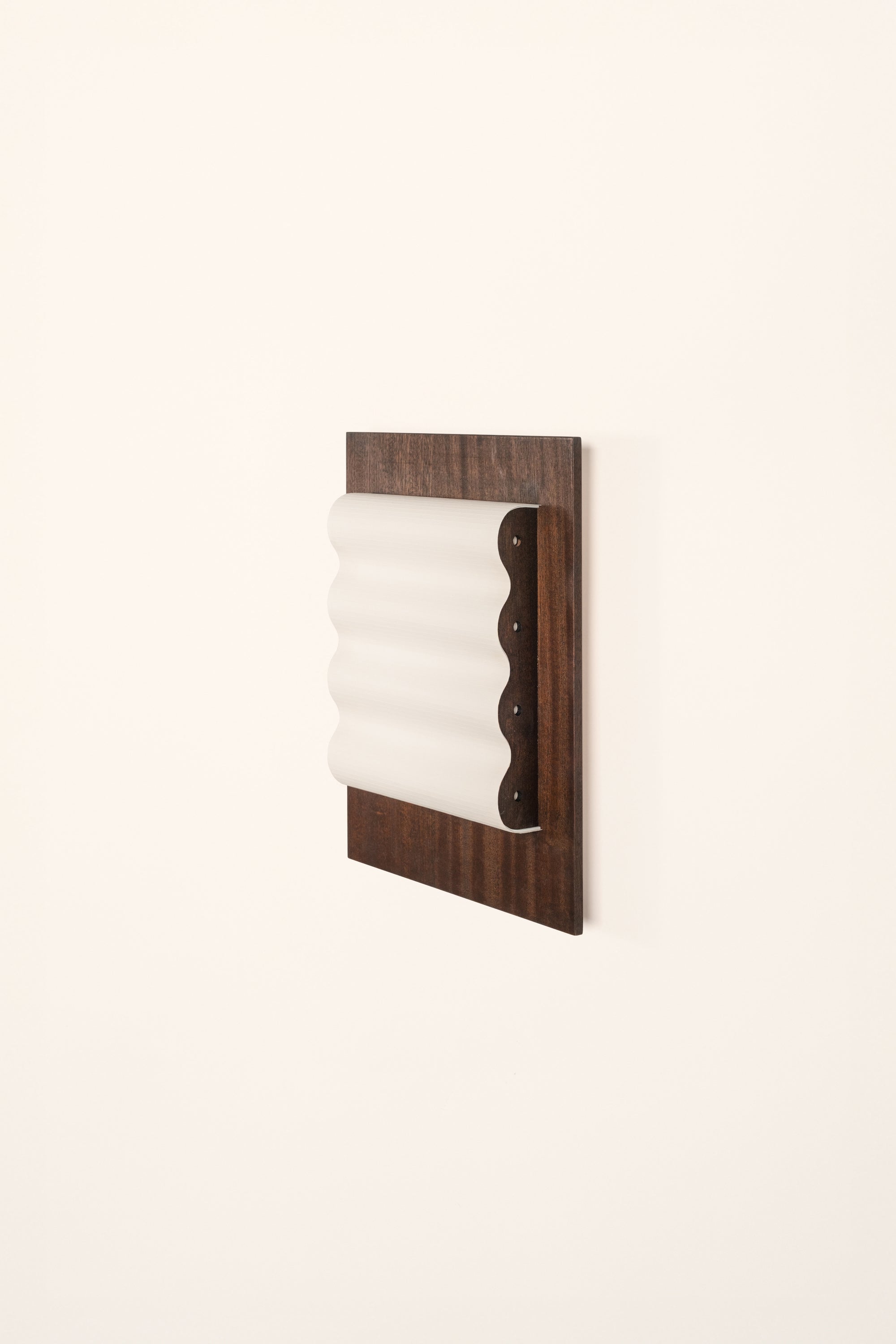 Framed wall light fixture in wood with a paper shade by Violaine d'Harcourt on a white background with light off.