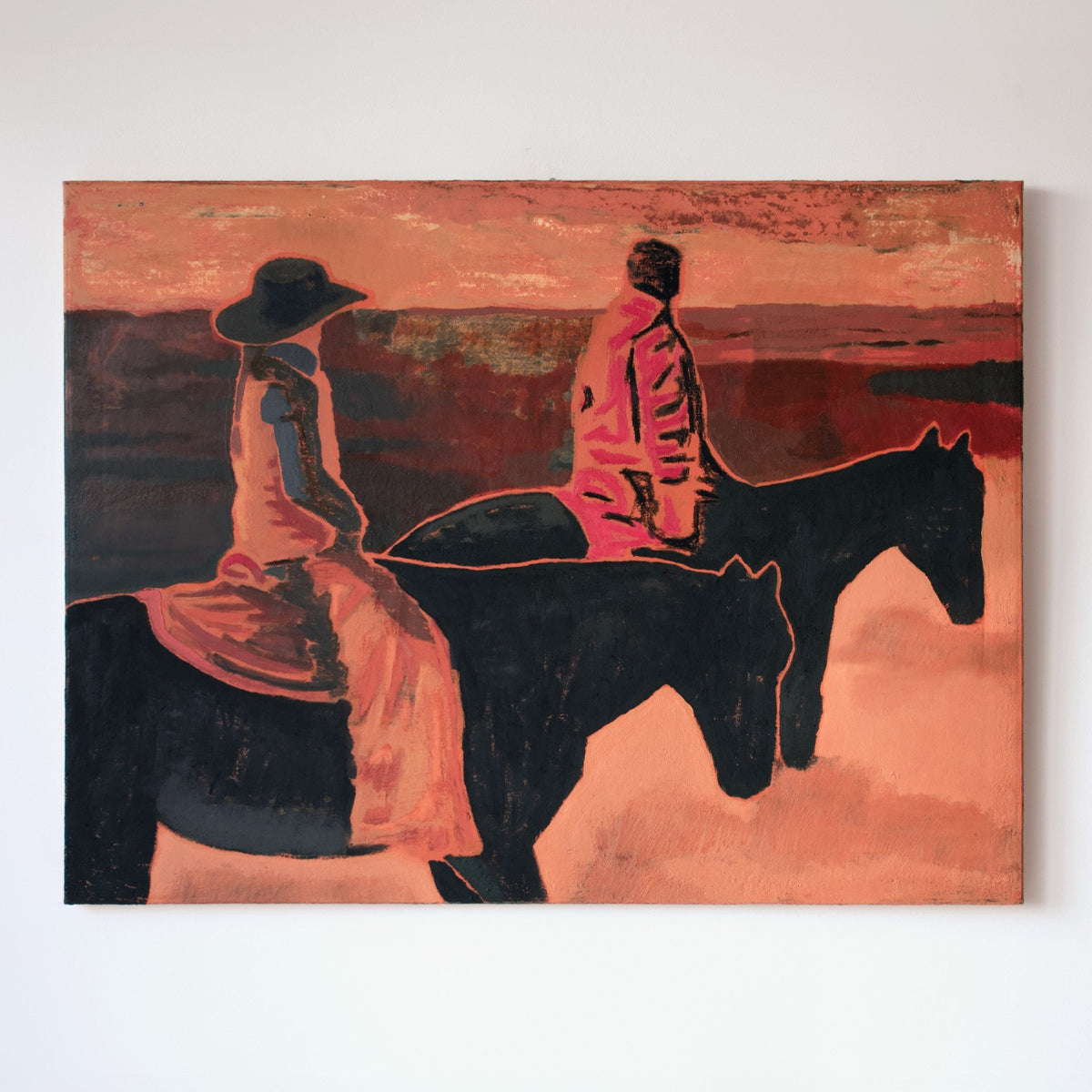 An original painting by Marcsen hanging on a white wall, depicting two riders on horseback in warm orange, red, black, and brown tones.