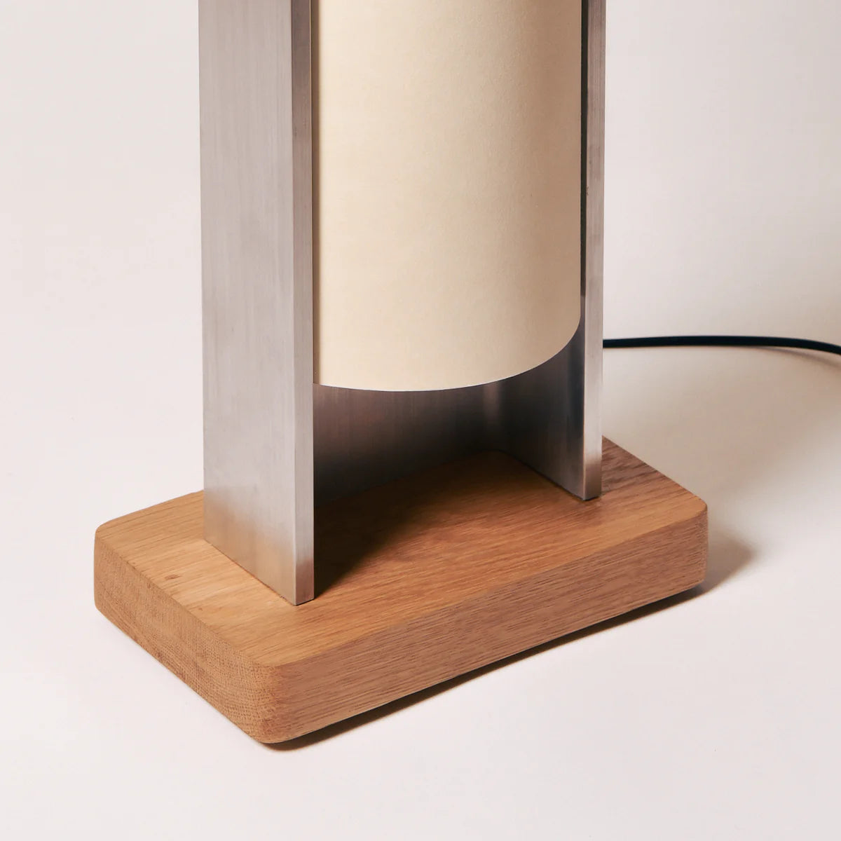 Close up of floor lamp by PARCTA with the light off, on a neutral background.
